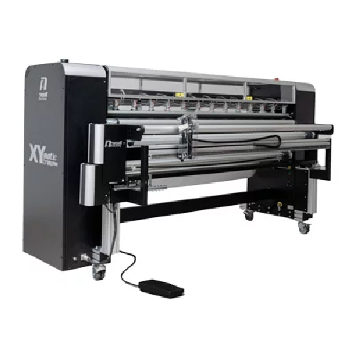 Neolt XY Matic Trim Plus machine trimming wallpaper rolls with precision and speed.